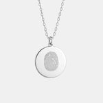 The Danibydsgn Single Fingerprint Pendant Necklace in 925 Sterling Silver — a minimalist round coin pendant featuring a finely engraved fingerprint design, symbolising love, memory, and personal connection in elegant handcrafted jewelry.