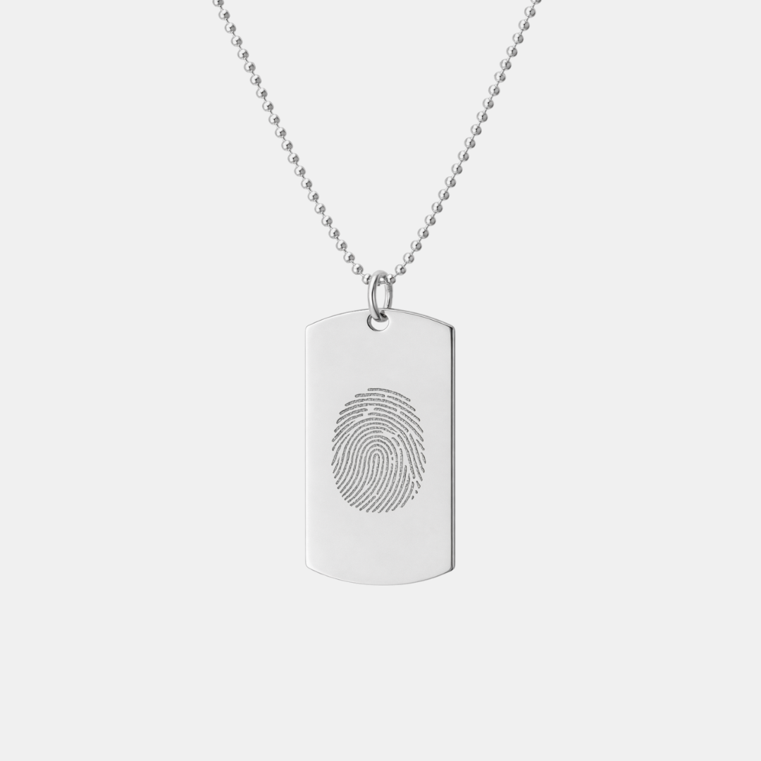 Danibydsgn 925 sterling silver dog tag pendant with custom diamond-engraved single fingerprint design, displayed hanging on adjustable bead chain