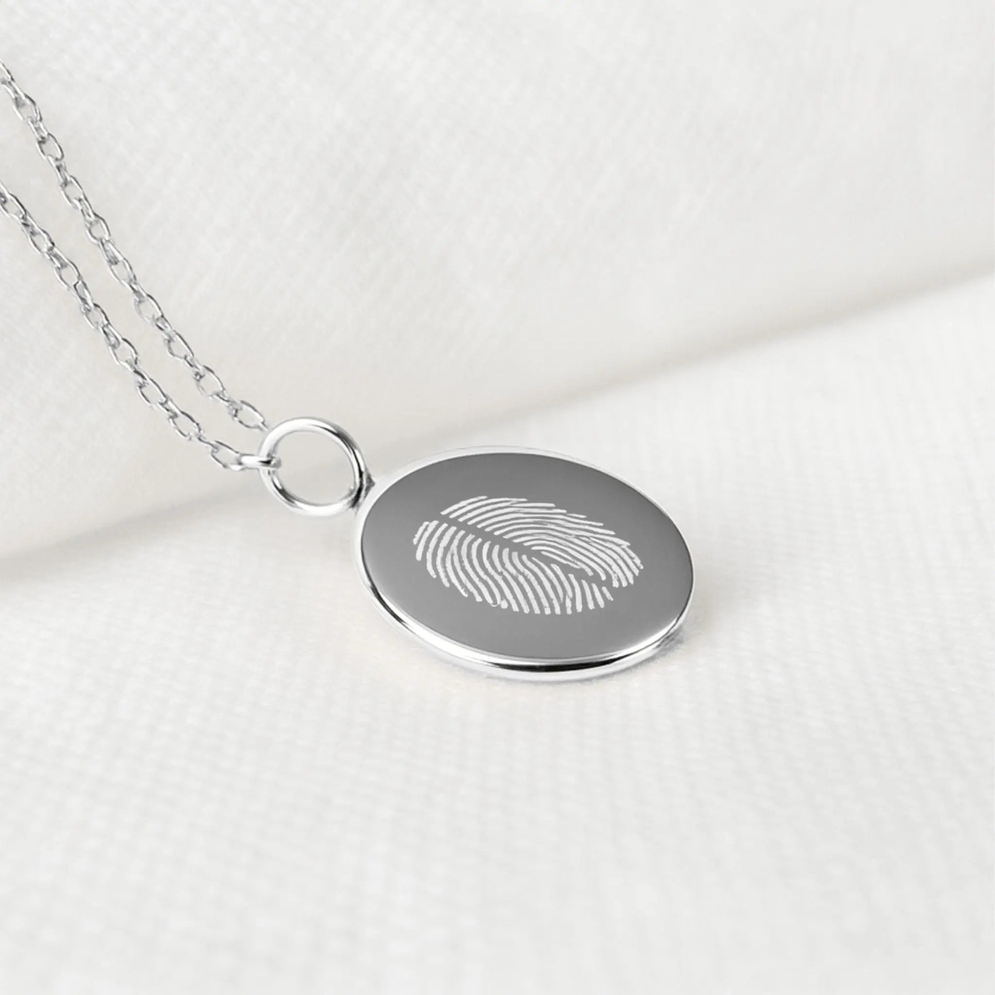 Two Fingerprint Coin Necklace by Danibydsgn in 925 sterling silver, showcasing detailed fingerprint engravings.