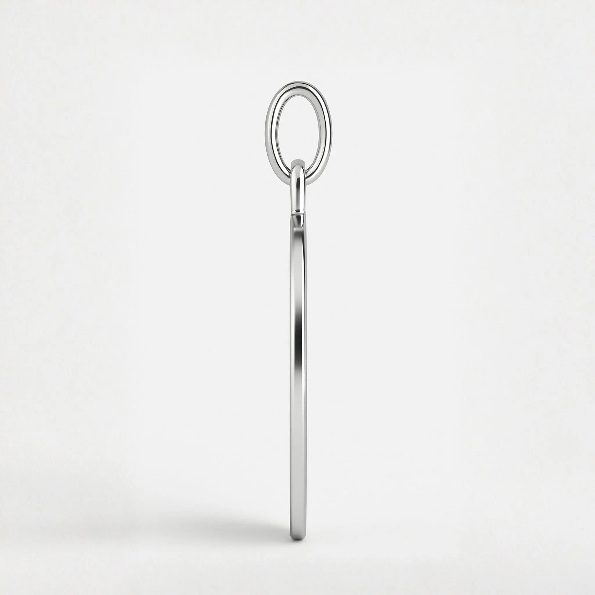 Side profile of the Danibydsgn Two Fingerprint Pendant Necklace in 925 Sterling Silver, showcasing the pendant’s sleek 1.5mm depth, smooth edges, and high-polish finish — a reflection of minimalist luxury and craftsmanship.