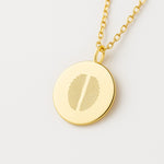 Two fingerprint pendant necklace in 18K gold vermeil by Danibydsgn, featuring dual engraved fingerprints on a polished gold disc. A meaningful custom keepsake symbolizing connection, love, or family—crafted with precision for timeless, luxury personalization.