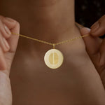 Duo fingerprint pendant necklace in 18K gold vermeil by Danibydsgn, worn close to the neck. Features dual engraved fingerprints symbolizing connection and love. A handcrafted, luxury personalized keepsake perfect for meaningful gifting or everyday elegance.