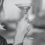 A chic '893' three Custom Initial Monograms tattoo design on a woman's wrist, as she holds a martini glass, design by Danibydsgn, showcases luxurious personal branding and custom logo design in the form of body art. This image reflects the high-end initial monogram custom logo designs suitable for special event marketing, wedding monograms, wall art and even clothing branding symbolizing an exclusive lifestyle or personal branding for body art.
