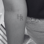 Fine line HR initial monogram tattoo design — minimalist, elegant lettering created by Danibydsgn.