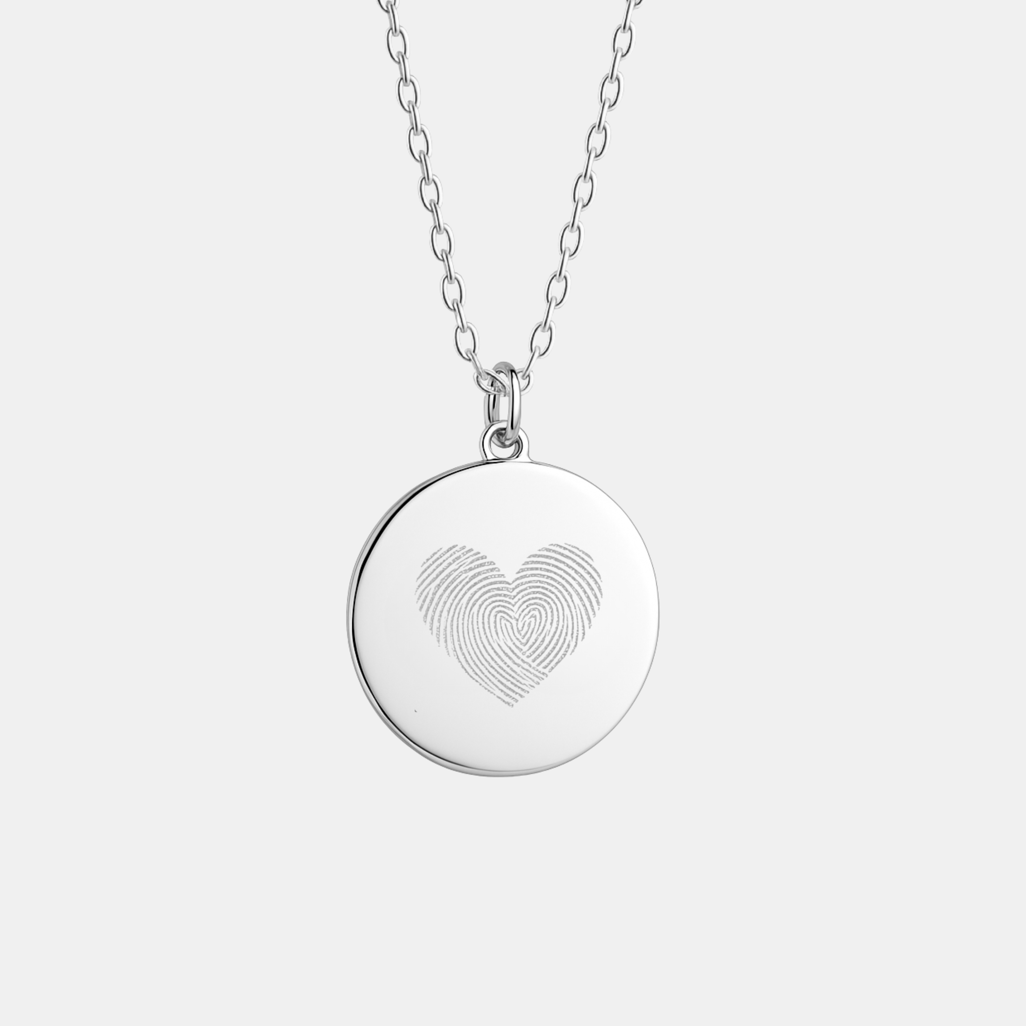 Heart fingerprint pendant necklace in 925 sterling silver featuring engraved fingerprints forming a heart, handcrafted by Danibydsgn.