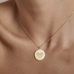 The Luxury Heart Fingerprint Necklace in 18K Gold Vermeil by Danibydsgn shown worn on the neck. Featuring two fingerprints forming a heart shape, this personalised pendant captures love and connection in a minimalist gold design, perfect for everyday elegance or as a meaningful keepsake gift.
