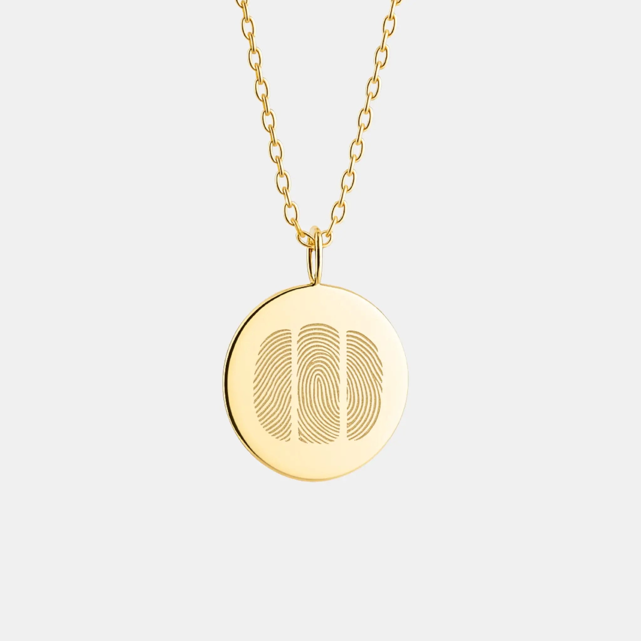 Luxury Three Fingerprint Coin Necklace in 18K Gold Vermeil by Danibydsgn — featuring three finely engraved fingerprints on a radiant gold coin pendant. A custom keepsake symbolizing love, family, and connection, crafted with premium diamond-cut detailing and timeless minimalist design.