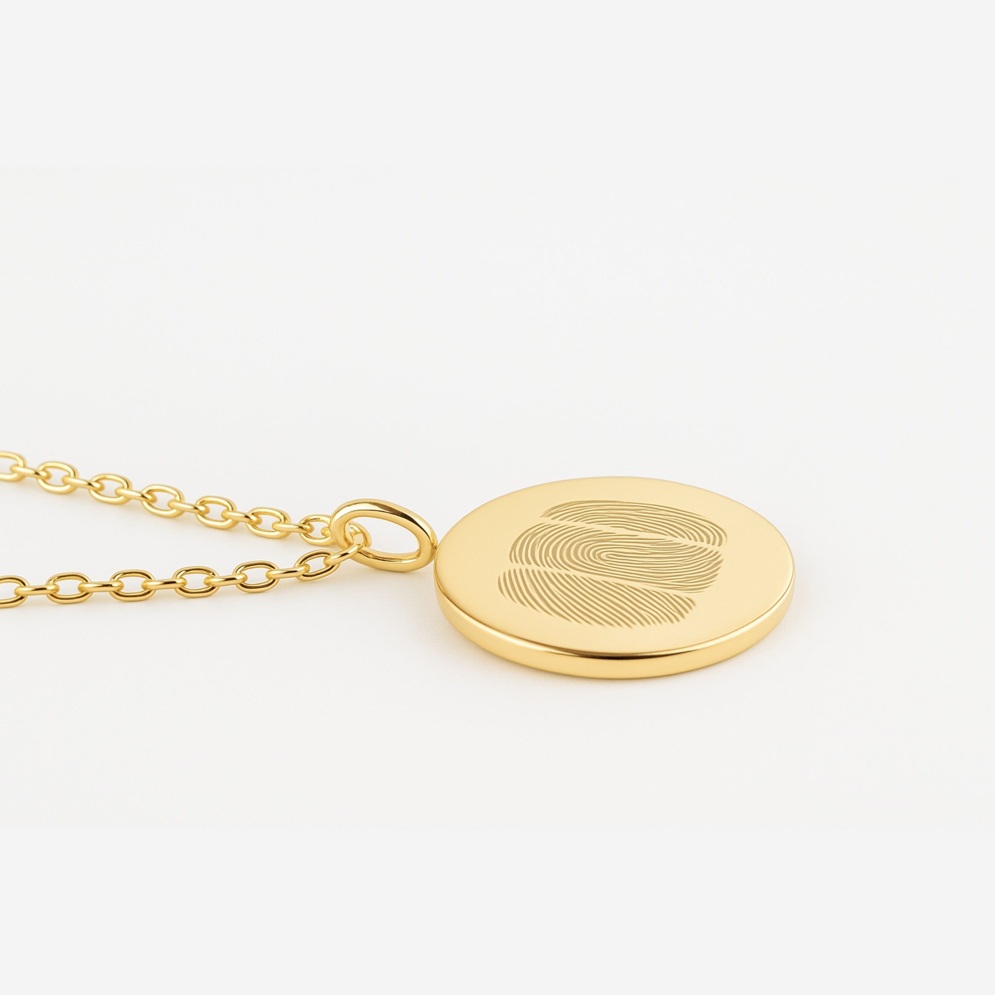 Luxury Three Fingerprint Coin Necklace in 18K Gold Vermeil by Danibydsgn, displayed on a soft white background. Features three precision-engraved fingerprints on a sleek gold pendant, representing love, connection, and craftsmanship. A timeless, custom piece designed for lasting elegance.