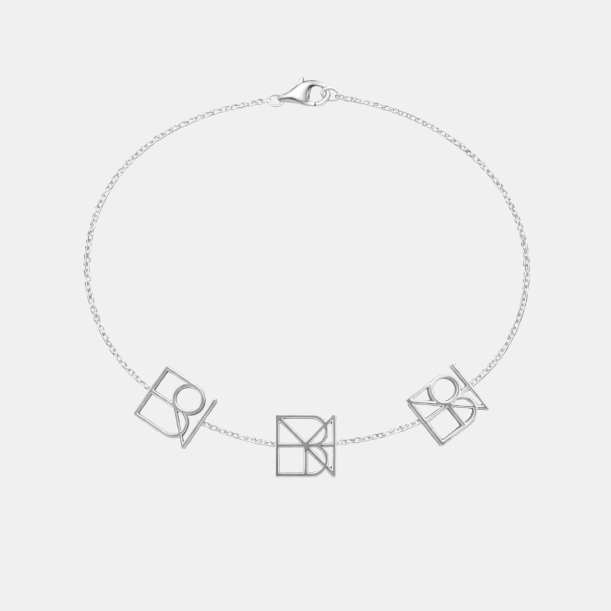 Custom 925 sterling silver bracelet featuring three unique geometric symbols on a delicate chain.