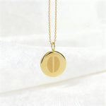 Two fingerprint pendant necklace in 18K gold vermeil by Danibydsgn, suspended elegantly against a soft white background. Features dual engraved fingerprints on a polished disc — a timeless, luxury keepsake symbolizing connection, unity, and bespoke craftsmanship.