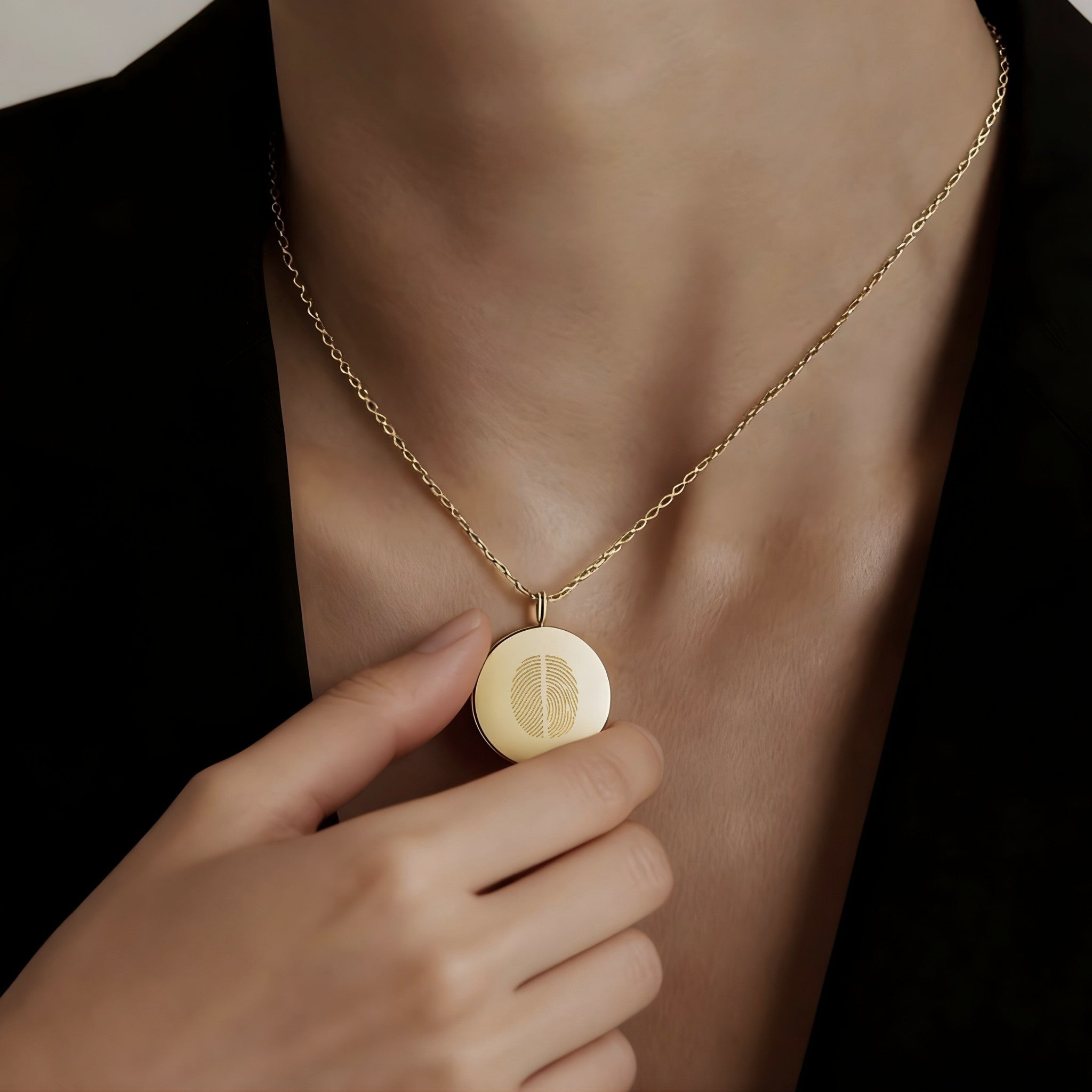Elegant model wearing the Two Fingerprint Coin Necklace in 18k Gold Vermeil by Danibydsgn — luxury personalized fine jewelry featuring dual engraved fingerprints on a radiant gold pendant.