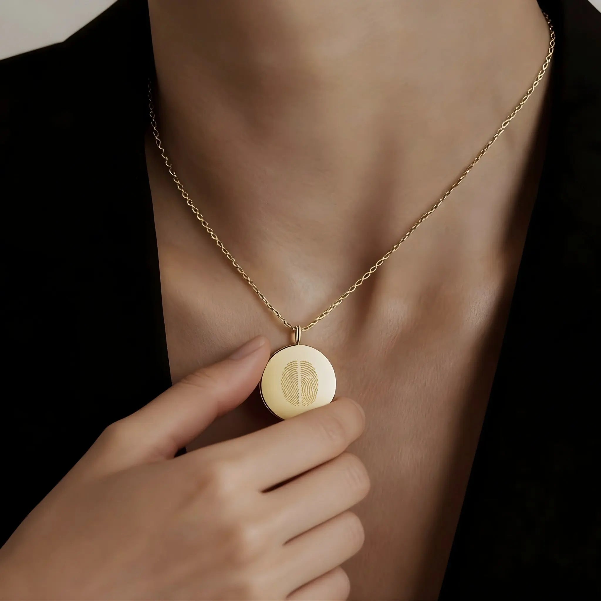 Elegant model wearing the Two Fingerprint Coin Necklace in 18k Gold Vermeil by Danibydsgn — luxury personalized fine jewelry featuring dual engraved fingerprints on a radiant gold pendant.
