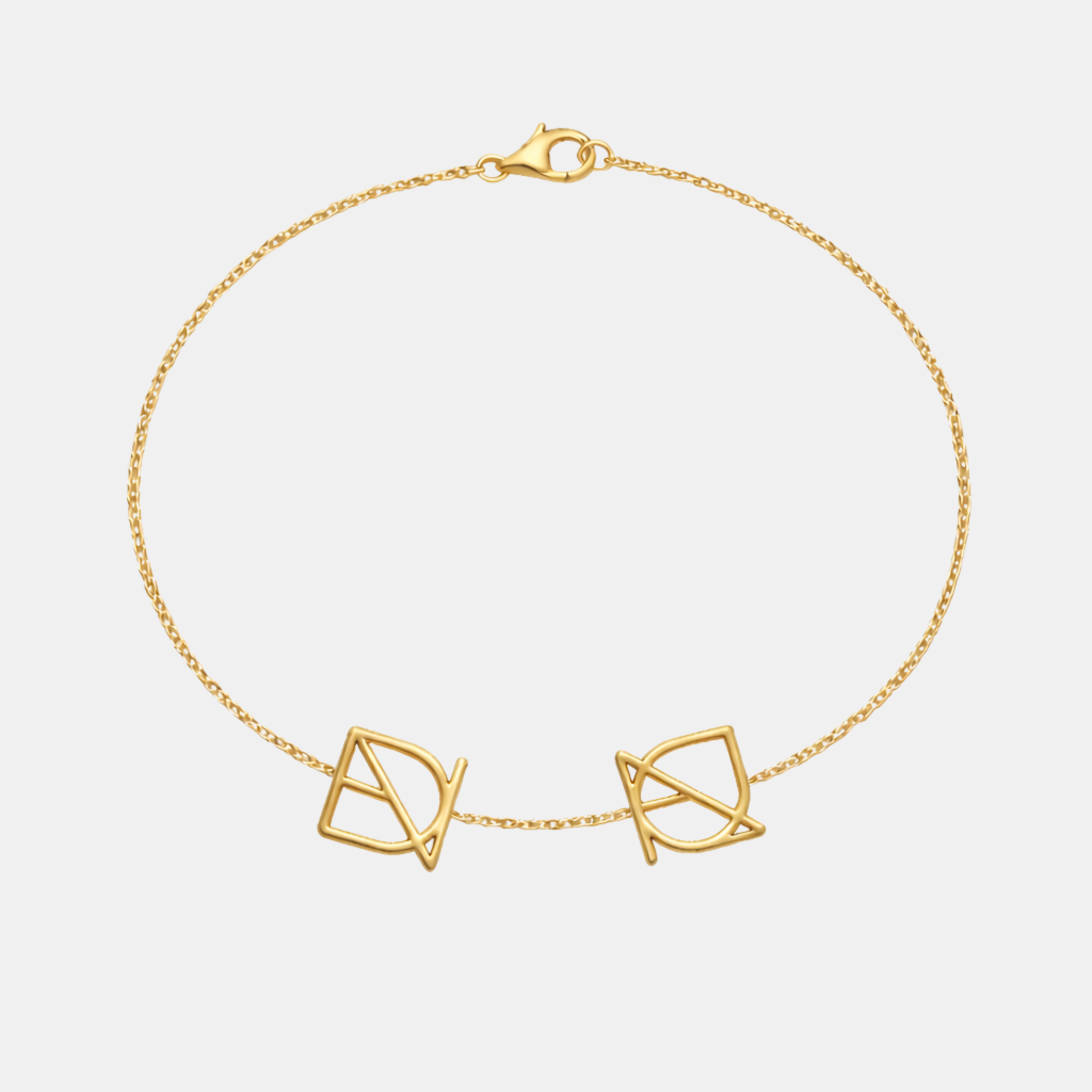 Custom 9k gold bracelet featuring two bespoke geometric symbols on a fine solid gold chain.