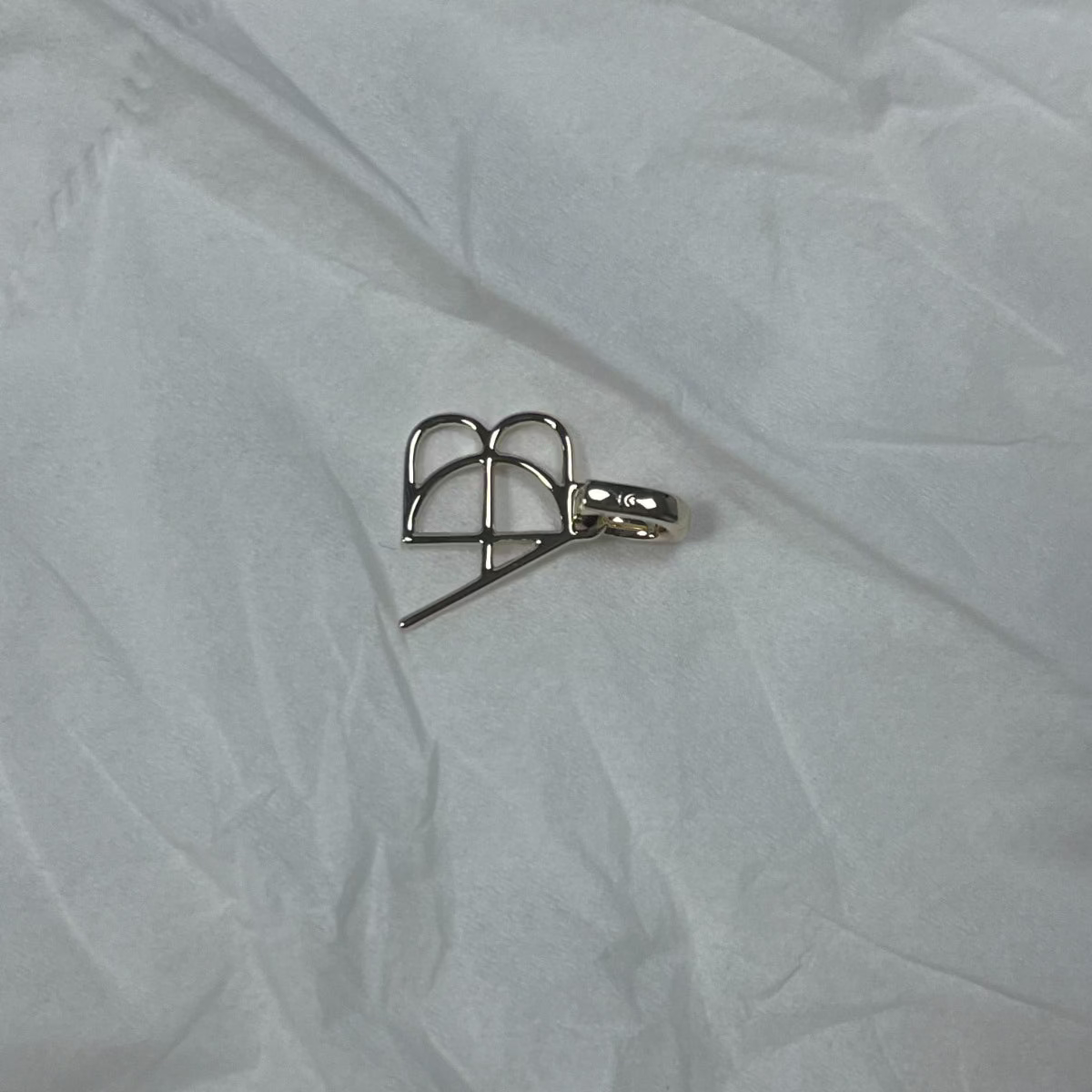 9k solid gold clip-on charm created from a Danibydsgn custom design symbol.  Hand made cut out symbol to add to existing jewelry collection or as a stand alone pendant.  Easily clips on to a chain, bracelet, tennis necklace or any other jewlry piece you may want to add it to.  Meaningful modern heirloom jewlry from Danibydsgn