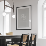 Two symbol, custom logo design joined diagonally to create the design.  The design is white letters on a grey background which has been printed , framed and used as wall art in a dining room.