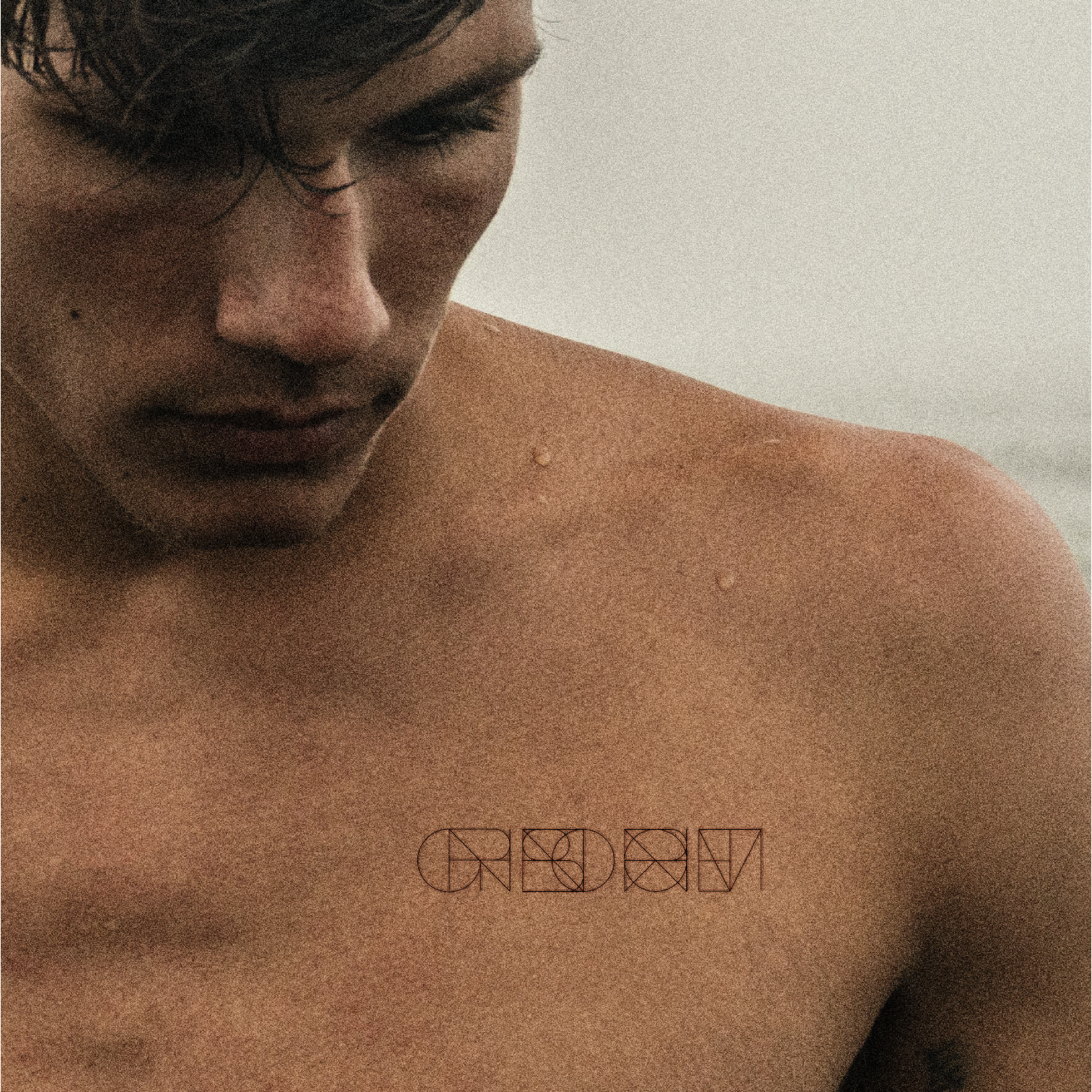 Photo is of a four symbol pre made logo design of a popular phrase tattooed onto the chest of a young man.  Premade logo deigns come ready-to-use as an instant download.  Perfect for an immediate branding solution.  