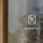 A marketing design package that includes social media graphics, email templates, and digital ads to help promote your brand and engage with customers.  The pic shows branding for "Cosmetics" and the logo has been used on their glass door in white vynal, entrance into the store. 