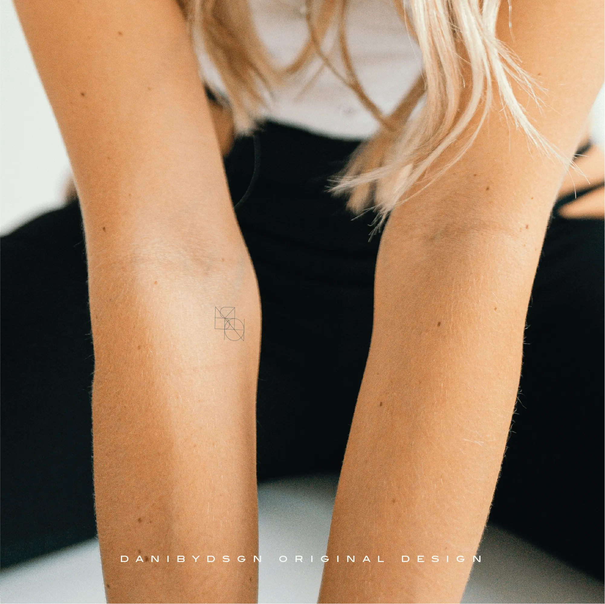 Minimal fine line tattoo design featuring a custom logo monogram by Danibydsgn.