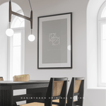 Distinct two-symbol custom joined logo design, where white letters are ingeniously joined diagonally and set against a grey background. This bespoke name logo design not only serves as a compelling piece of personal branding but has been elegantly printed and framed, into a piece of wall art that enhances the ambiance of any room. The entwined logo embodies simplicity and sophistication, reflecting a versatile approach to body art, fineline tattoo, clothing branding, and illustrative work.